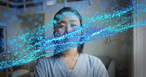 Nurse wearing scrubs with cyan particle stream overlay for futuristic digital healthcare