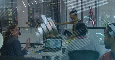 Diverse business team analyzing financial data projections in office