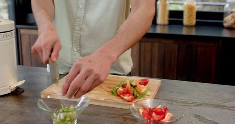 Chopping Vegetables in Modern Home Kitchen