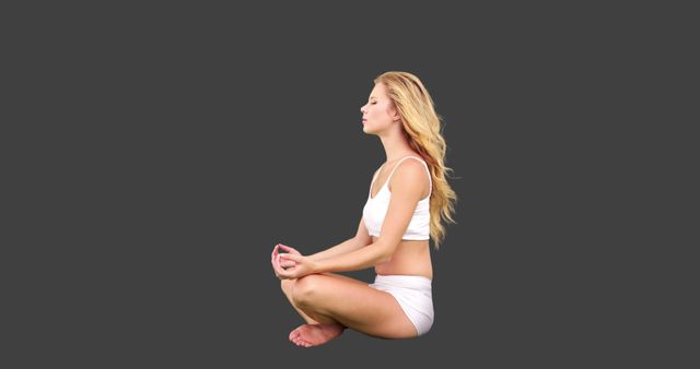 Young Woman Meditating in Lotus Position Against Gray Background - Download Free Stock Images Pikwizard.com