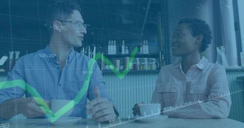 Business Colleagues Analyzing Market Trends Over Coffee