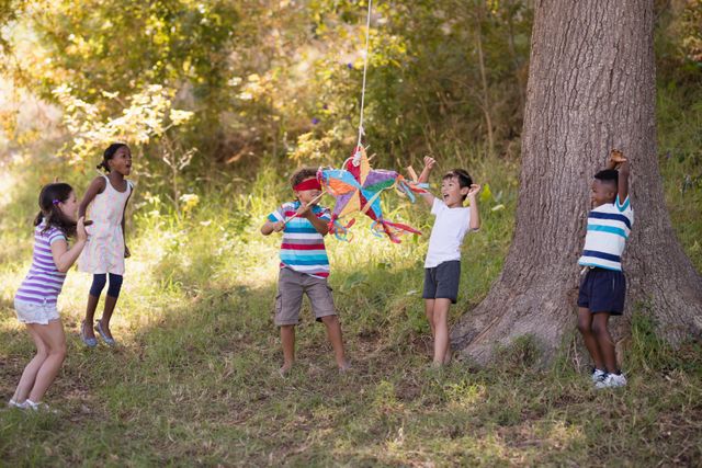 Children Playing with Pinata in Forest - Download Free Stock Images Pikwizard.com