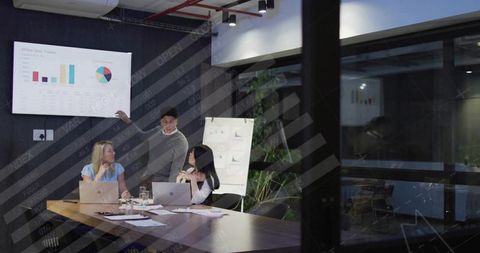 Business Team Analyzing Online Sales in Modern Meeting Room