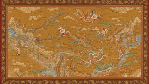 Intricate tapestry with dragons and phoenix design
