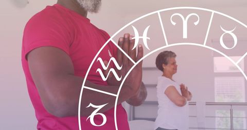 Senior African American Couple Practicing Yoga with Astrology Theme