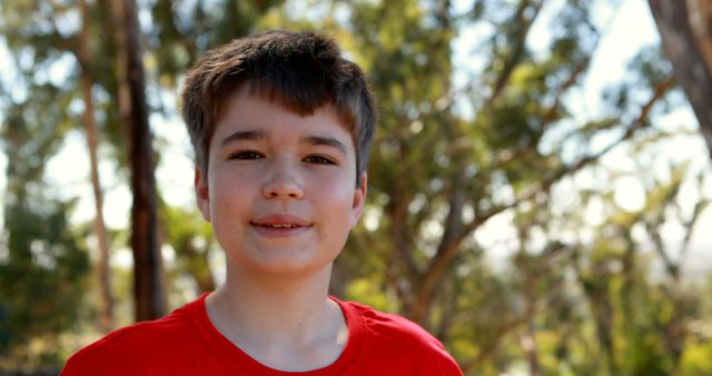 Smiling Teen Outdoors Sunlit Forest Background, Red T-shirt Youth - Download Free Stock Images Pikwizard.com