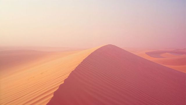 Sunset Over Serene Dune Ridge in Vast Desert