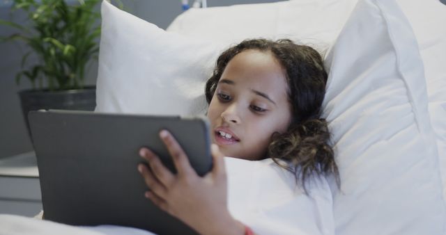 Young Girl Lying in Bed Using Tablet - Download Free Stock Images Pikwizard.com