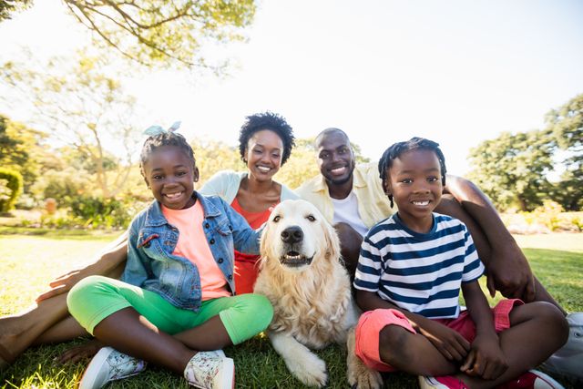 Happy African American Family with Dog in Park - Download Free Stock Photos Pikwizard.com