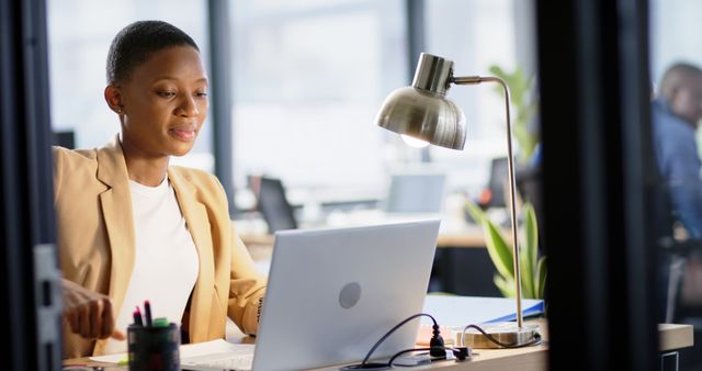 Focused African American Woman Working on Laptop in Office - Download Free Stock Images Pikwizard.com