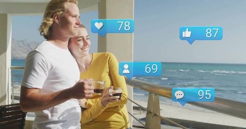 Couple Relaxing on Beachside Balcony with Social Media Interaction Icons