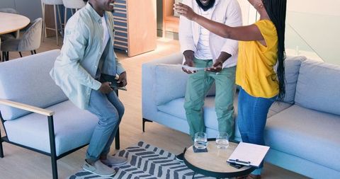 Warm Welcome in Cozy Living Room: Handshake and Smiles