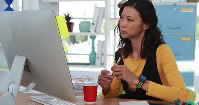 Focused Woman Working on Computer in Bright Office - Download Free Stock Images Pikwizard.com