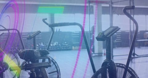 Modern Cardio Fitness Studio with Air Bikes and Dumbbells