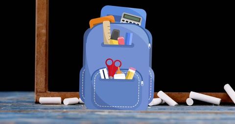School bag with stationery items symbolizing back to school