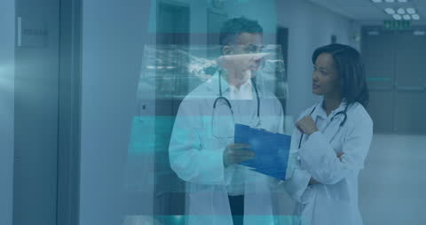 Doctors Discussing in Hospital with Digital Data Overlay