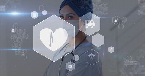 Asian clinician wearing scrubs and mask viewing futuristic digital healthcare interface