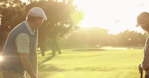 Senior Couple Enjoying Golf at Sunset on Lush Course - Download Free Stock Images Pikwizard.com