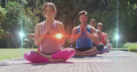 Group meditation sessions outdoors in scenic garden settings