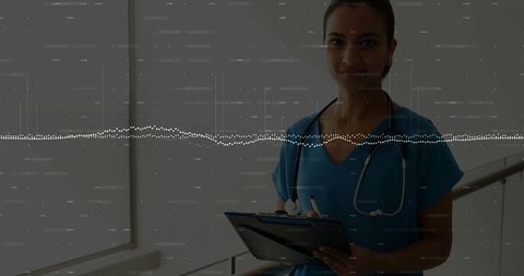 Confident doctor using digital tablet in modern clinic