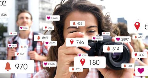 Young woman shooting dslr in city with social media notification overlays and backpack traveler