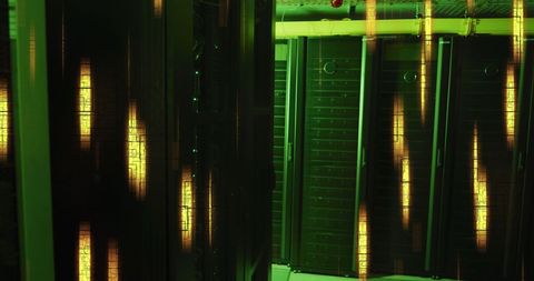 Green Lit Server Room with Glowing Yellow Data Process Lighting - Download Free Stock Images Pikwizard.com