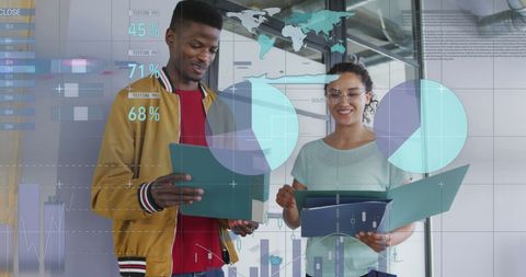 Diverse coworkers collaborating with infographics in modern office