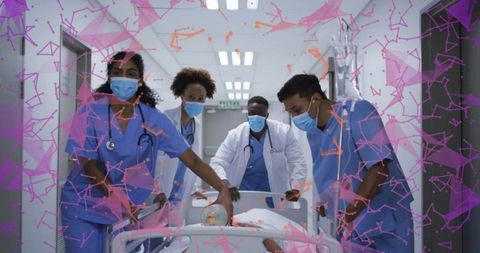 Medical Team Transporting Patient on Stretcher in Hospital Hallway