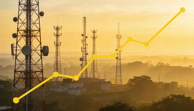 Telecom network growth concept showing rising data graph over rural cell towers at dawn