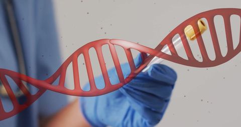 Scientist examines dna strand with vial