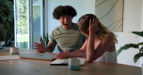 Young Couple Experiencing Happiness at Home