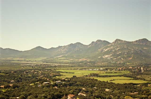 Panoramic View of Countryside with Mountain Range and Clear Sky - Download Free Stock Photos Pikwizard.com