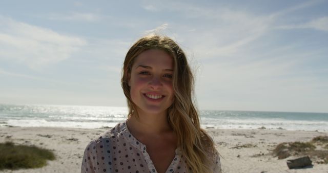 Young Woman Smiling by the Beach on a Sunny Day - Download Free Stock Images Pikwizard.com