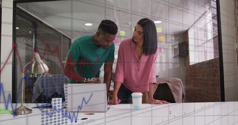 Team Discussing Financial Data in Modern Office Setting