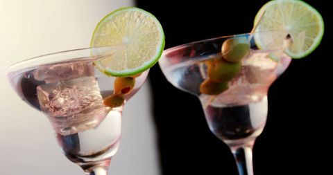 Classic Martini Cocktails with Lime and Olive Garnish - Download Free Stock Images Pikwizard.com