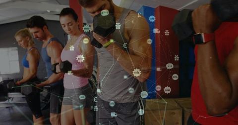 Group strength training with dumbbells and wearable tech showing fitness data overlay