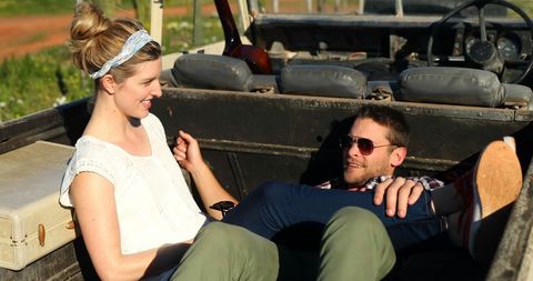 Couple Relaxing in Open Vehicle on Sunny Day