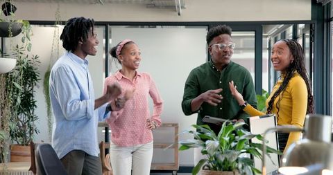 Happy Team Celebrating Success in Modern Office