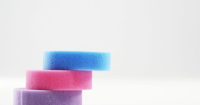 Stack of Colorful Sponges on White Background - Download Free Stock Images Pikwizard.com