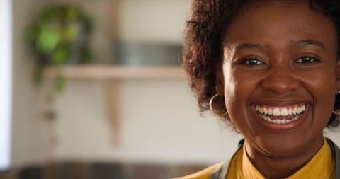 Cheerful Woman Cooking at Home in Cozy Kitchen Setting