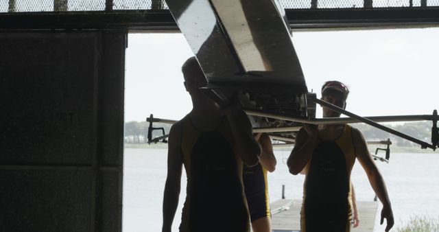 Rowing Team Carrying Boat from Boathouse to Lake - Download Free Stock Images Pikwizard.com