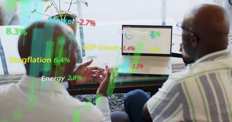 Colleagues analyzing financial dashboard with market overlays and candlestick charts