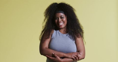 Confident African American Woman Smiling in Minimalist Fashion