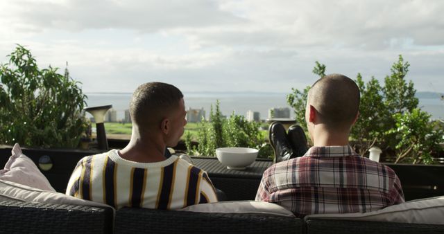 Couple Relaxing on Outdoor Patio Overlooking Scenic Cityscape - Download Free Stock Images Pikwizard.com