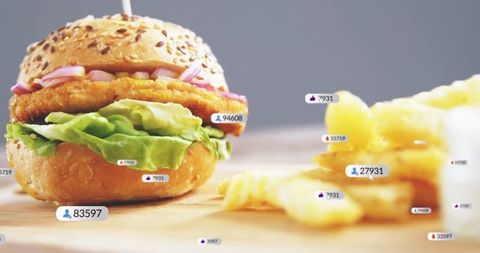 Deluxe burger and fries with social media icons overlay