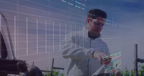 Technician Engaged in Digital Analysis at Industrial Site