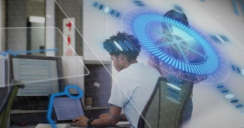 Professional reviewing code and analytics on laptop with futuristic hud overlay