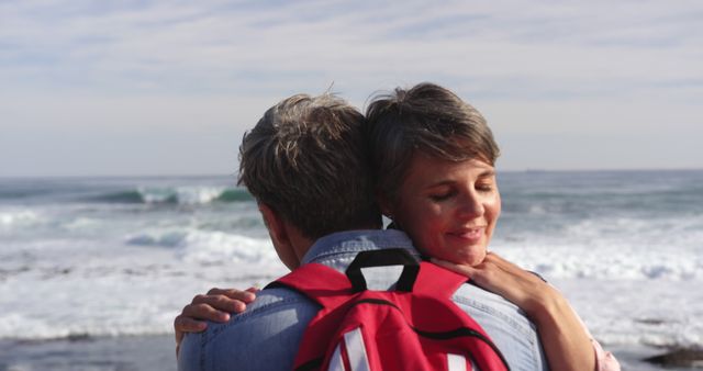 Senior Couple Embracing Near Ocean Waves at Beach - Download Free Stock Images Pikwizard.com
