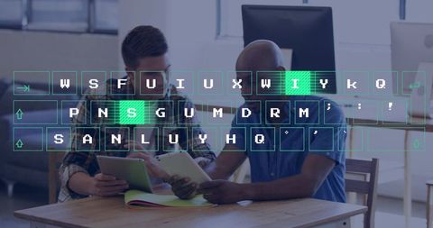 Two colleagues collaborating on tablets with virtual keyboard overlay in coworking workspace