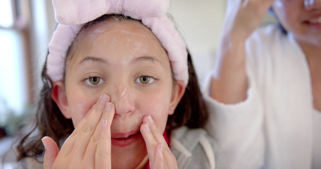 Young Girl Applying Facial Cream During Skincare Routine - Download Free Stock Images Pikwizard.com